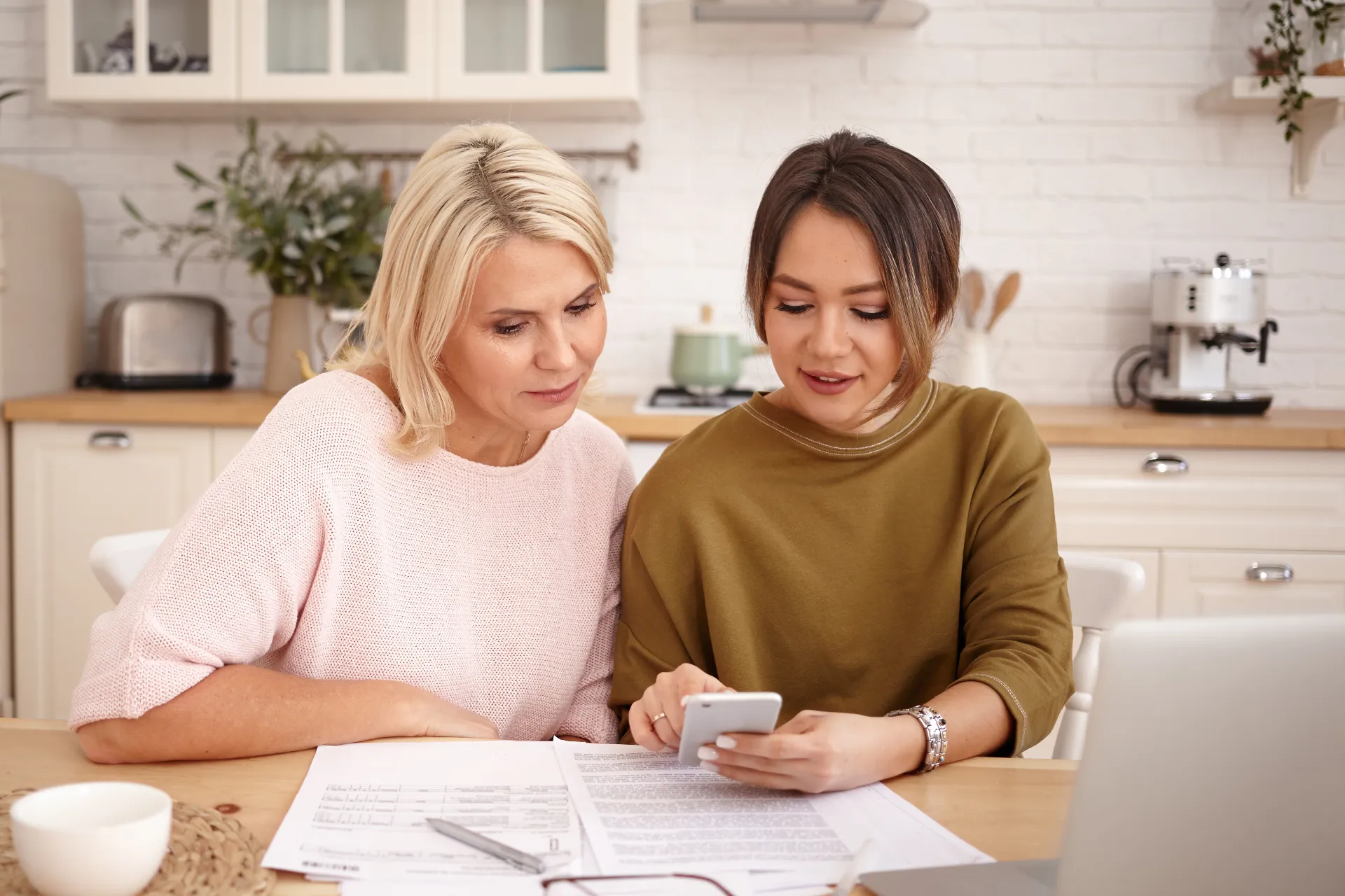 A couple reviewing a loan agreement together on a tablet